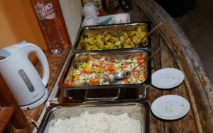 Three bowls with rice, vegetable salad and potatoes