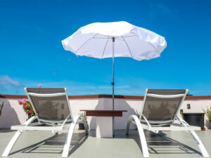 Sun loungers and parasol on the terrace